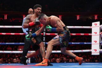 Shakur Stevenson punches Teofimo Lopez during a boxing match. Credit: Cris Esqueda Matchroom Boxing