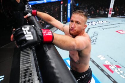 Justin Gaethje holds the Octagon during the break at UFC 324