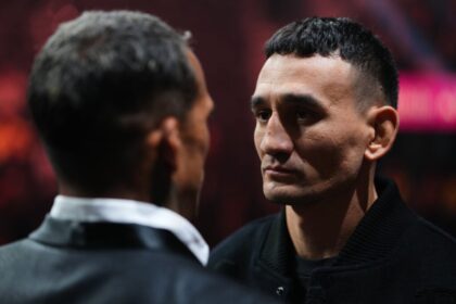 Max Holloway stares down Charles Oliveira during the showdown