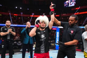 Umar Nurmagomedov raises his hand after victory at UFC 324
