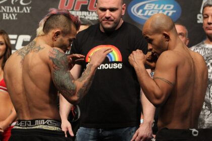 Dana White stands between Noriyoshi Yamamoto and Demetrius Johnson ahead of UFC 126