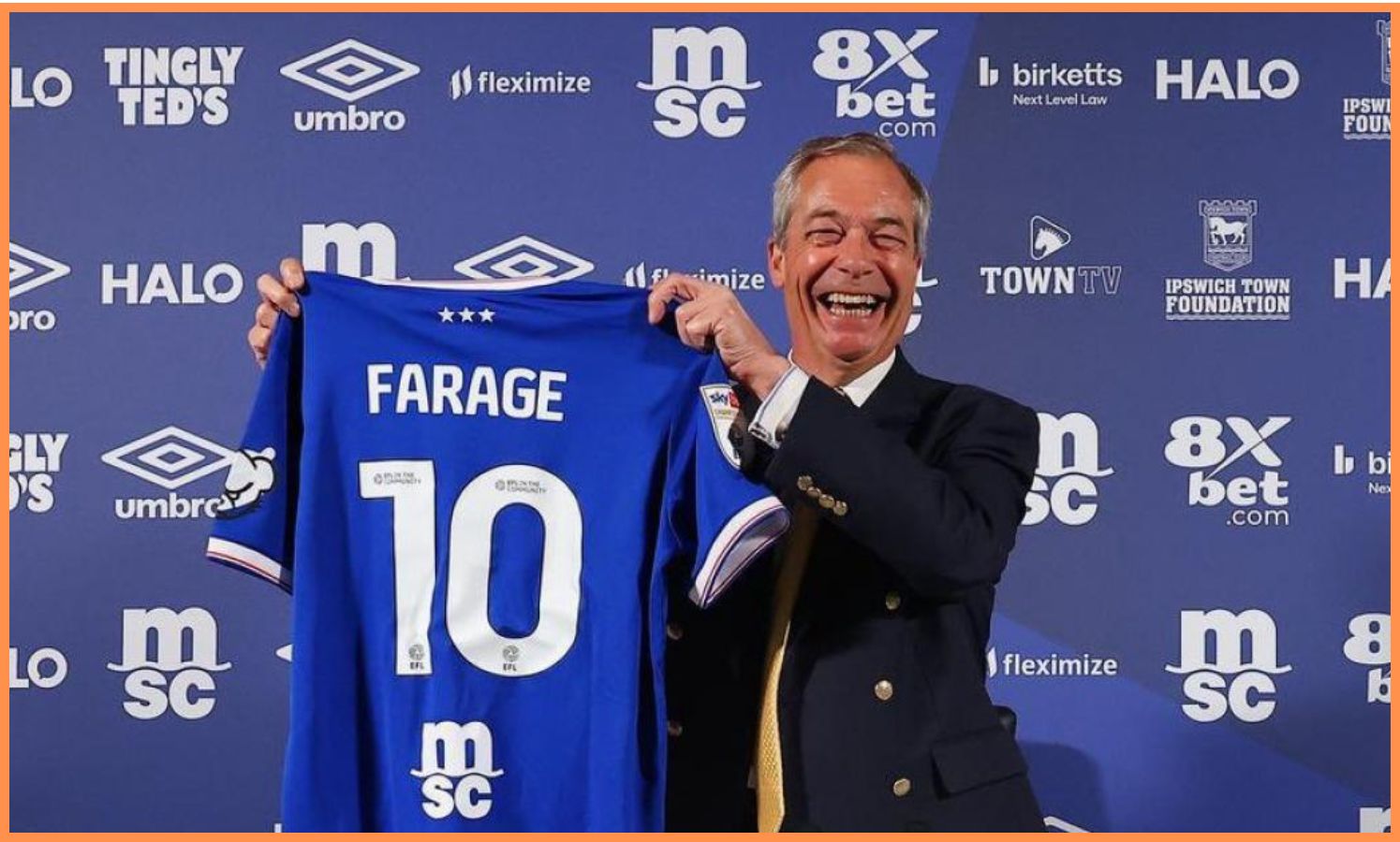 Nigel Farage posting with an Ipswich Town shirt