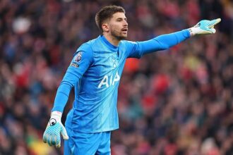 Guglielmo Vicario in action for Tottenham vs Liverpool
