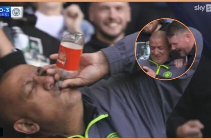 Manchester City fan with Arsenal branded bottle