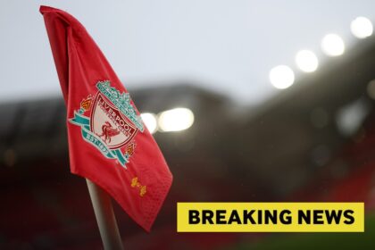 A Liverpool FC corner flag at Anfield, plus a