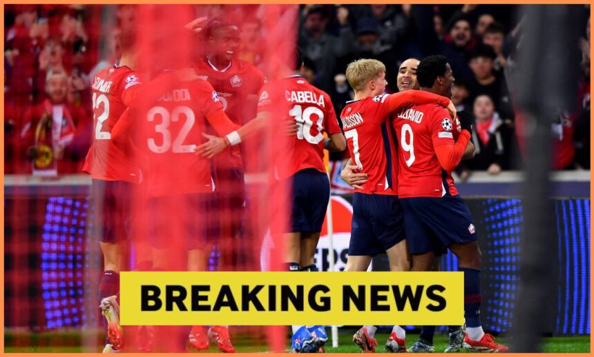Jonathan David celebrates with his Lille teammates