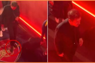 Diego Simeone walking on the Arsenal badge