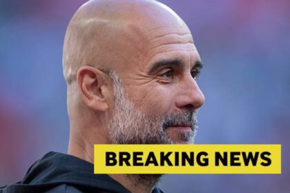 Pep Guardiola looks on