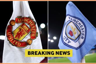 Manchester United and Manchester City logos on corner flags