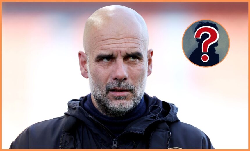 Manchester City manager Pep Guardiola looks on