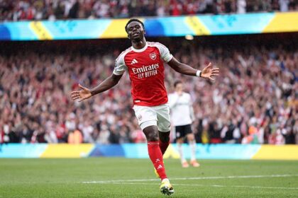 Saka celebrates after scoring