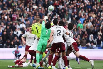 David Raya in a crowd allegedly being fouled