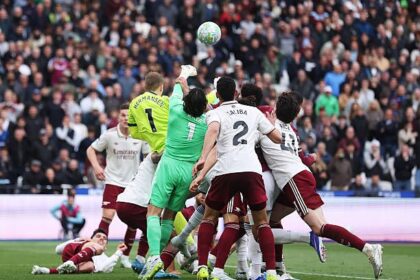 David Raya in a crowd allegedly being fouled
