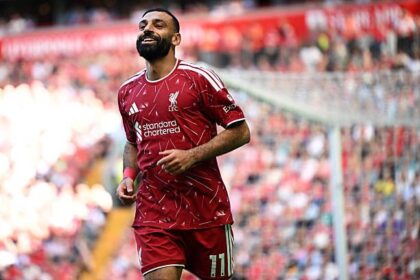 Mohamed Salah celebrates his assist for Curtis Jones