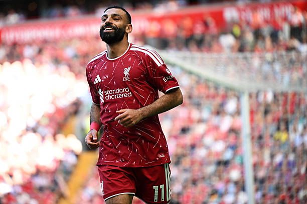 Mohamed Salah celebrates his assist for Curtis Jones