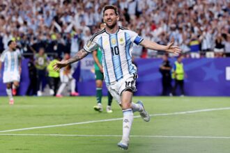 Lionel Messi celebrates record breaking goal