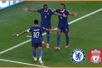 Jules Kounde celebrates with his France teammates at the World Cup