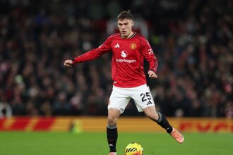 Manchester United midfielder Manuel Ugarte in action against Wolves