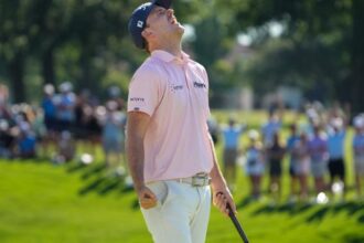 Russell Henry reacts on the 18th green after winning the Charles Schwab Challenge on the first hole of a sudden-death playoff