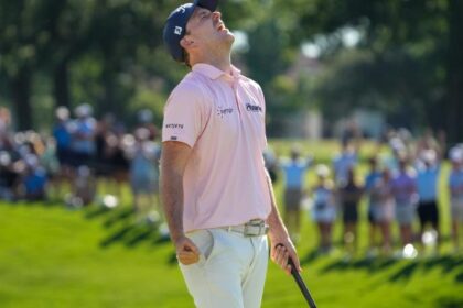 Russell Henry reacts on the 18th green after winning the Charles Schwab Challenge on the first hole of a sudden-death playoff