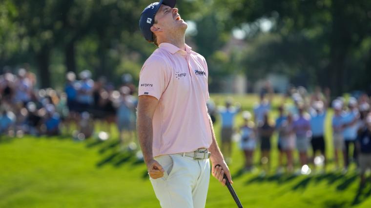 Russell Henry reacts on the 18th green after winning the Charles Schwab Challenge on the first hole of a sudden-death playoff