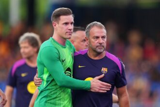 Marc-Andre Ter Stegen of FC Barcelona embraces Hansi Flick