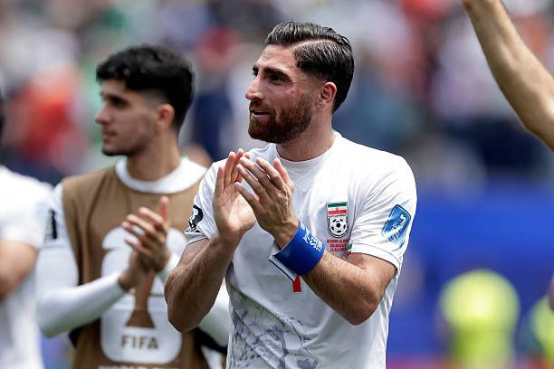 Alireza Jahanbakhsh of Iran celebrates the draw during the World Cup match between Belgium v Iran
