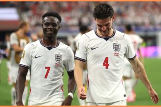 Bukayo Saka and Declan Rice react after England
