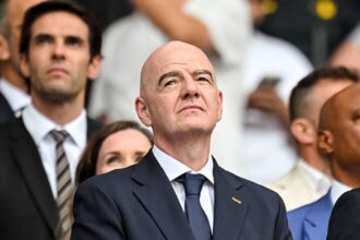 Gianni Infantino watching a World Cup game from the stands