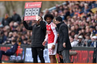 Jaden Dixon is subbed on by Arsenal manager Mikel Arteta