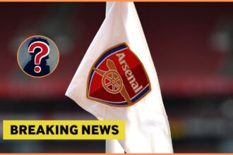 Arsenal logo on corner flag, and breaking news banner