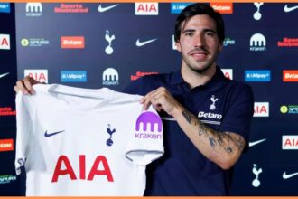 Sandro Tonali holding up a Tottenham shirt (Tottenham Hotspur official)