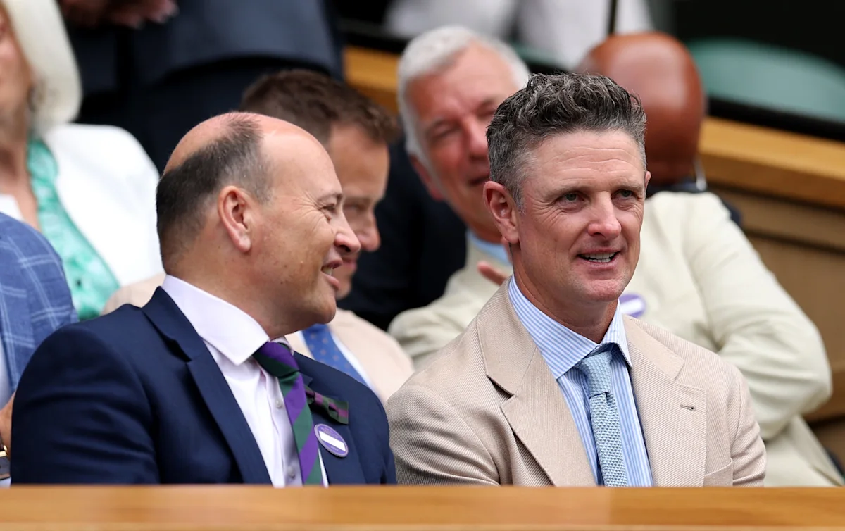 LONDON, ENGLAND - JULY 01: Golfer Justin Rose (R) speaks with writer Sir Keith Ajegbo in the Royal Box on day two of The Championships Wimbledon 2026 at All England Lawn Tennis and Croquet Club on June 30, 2026 in London, England.