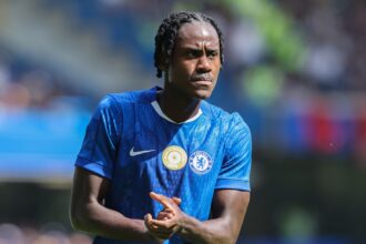 Trevoh Chalobah rubs his hands during Chelsea game.