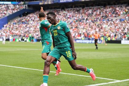 Ismaila Sarr celebrates after scoring vs Belgium