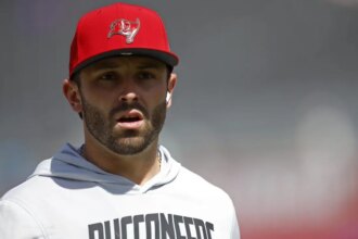 Baker Mayfield Exits Loss to Vikings with Dislocated Thumb, Expected to Miss Time
