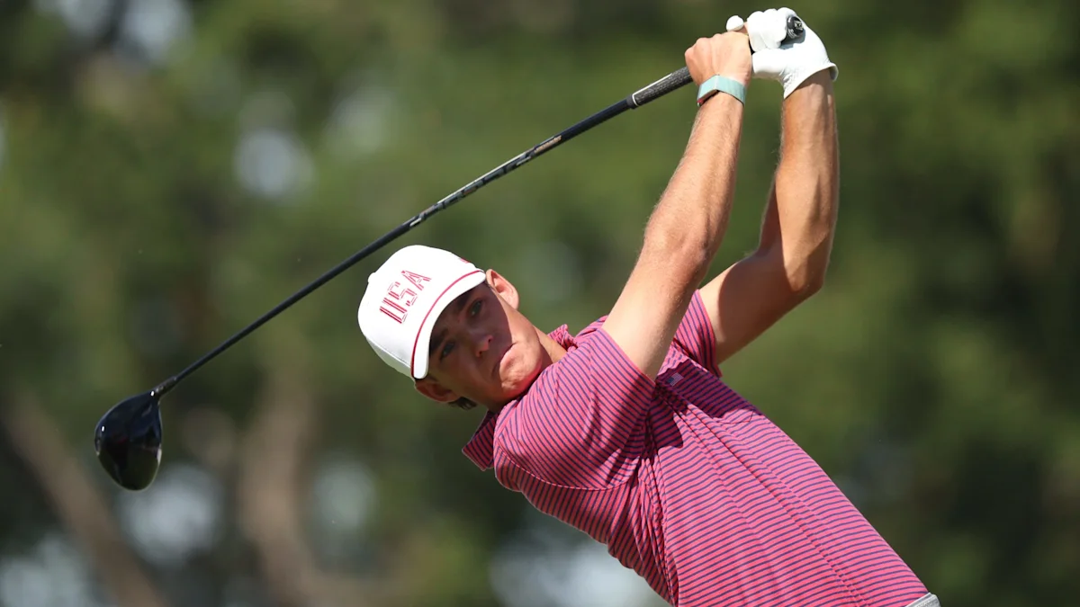 Jackson Koivun showcases golf equipment at the Presidents Cup