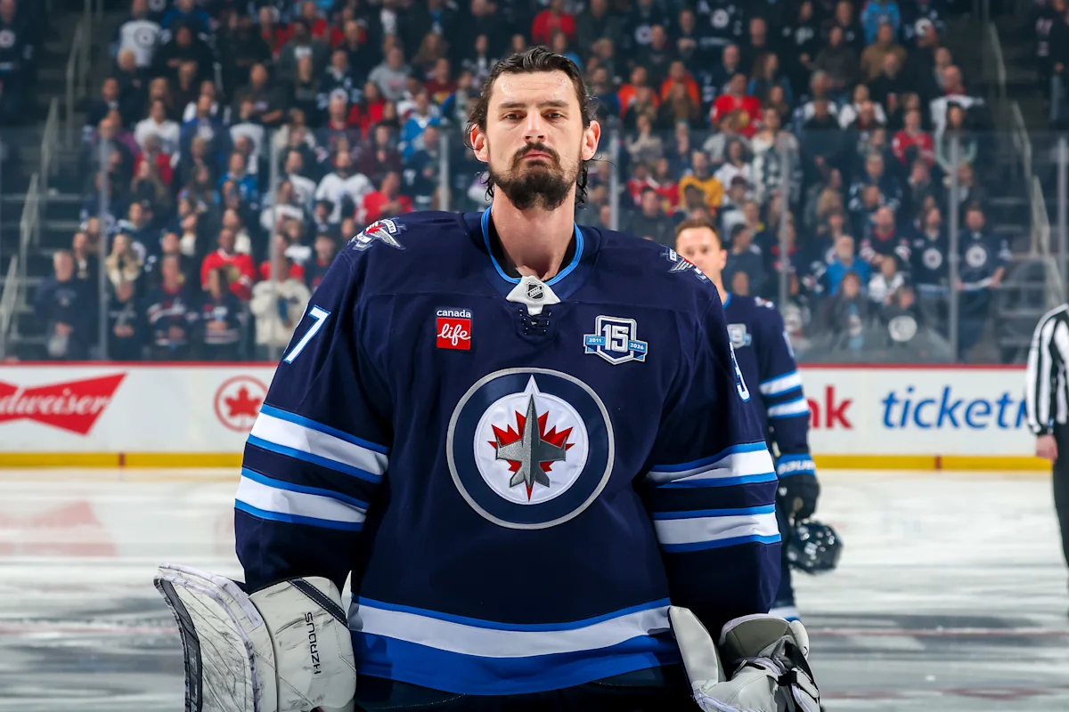 Jets GM continues trade talks for suspended goalie Connor Hellebuyck