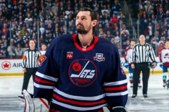 Jets suspend Connor Hellebuyck for failure to report to training camp after trade request
