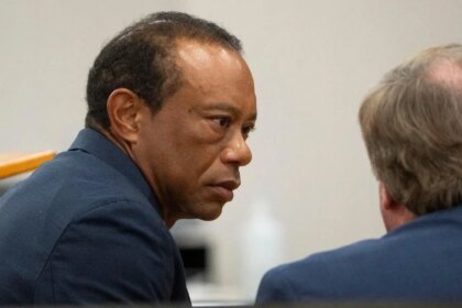 Tiger Woods pleads guilty in DUI case, receives five-year license suspension.