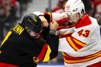 Merilainen makes 23 saves in first start for Canucks in 4-1 win over Flames