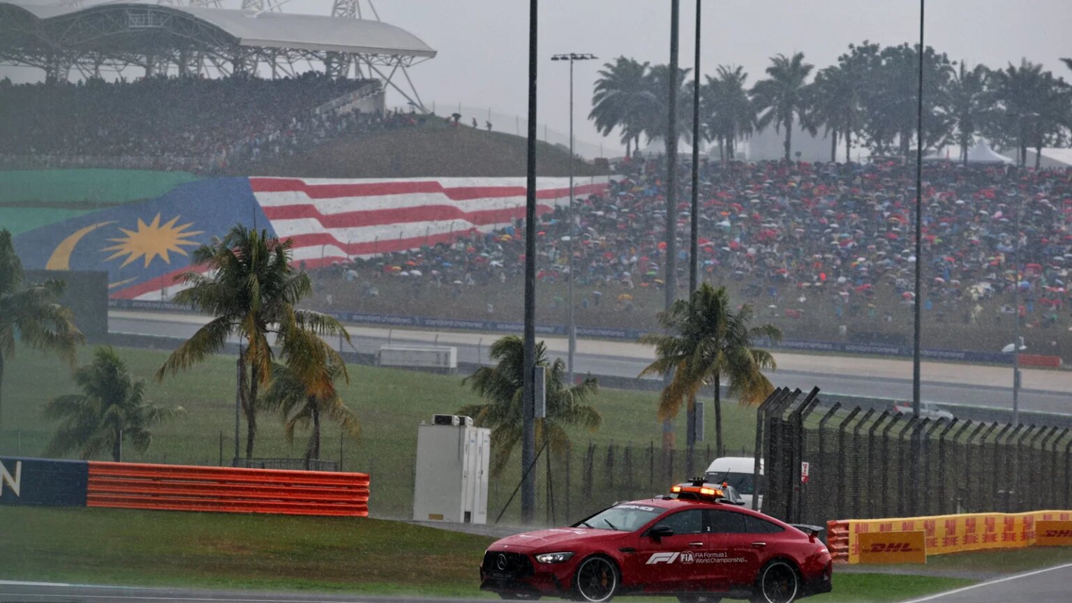 Start of F1 Bahrain GP in Malaysia delayed after heavy rainstorm