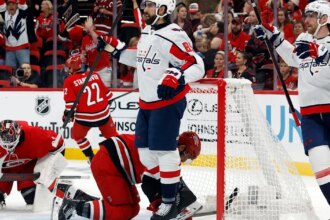 Tuch scores twice in his debut to lead Capitals past Hurricanes 5-2